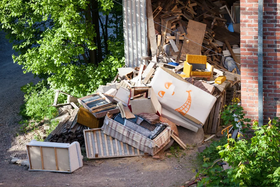 Discarded furniture and ordinary contents outside a building