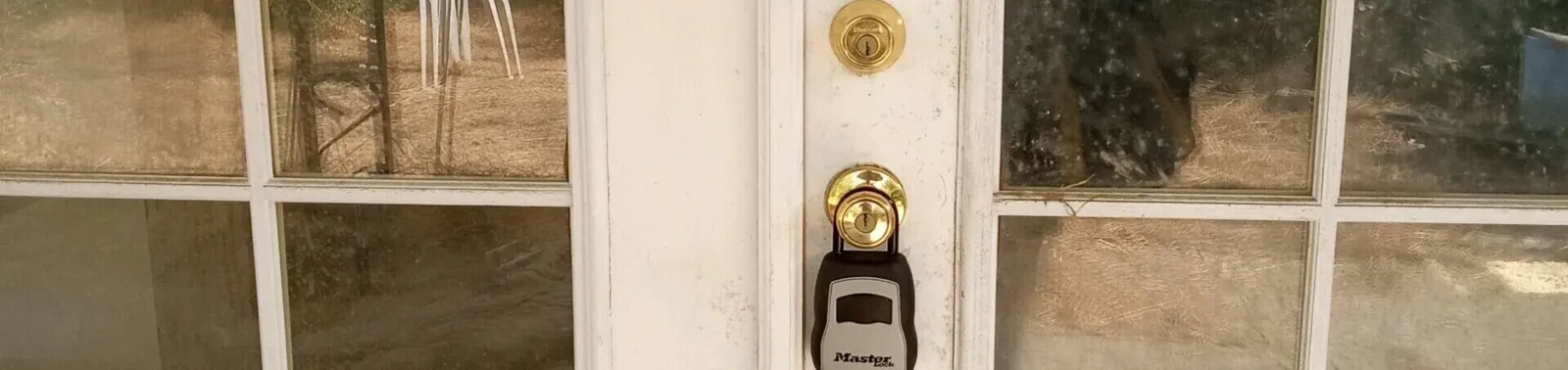 Lockbox on an exterior door with a deadbolt